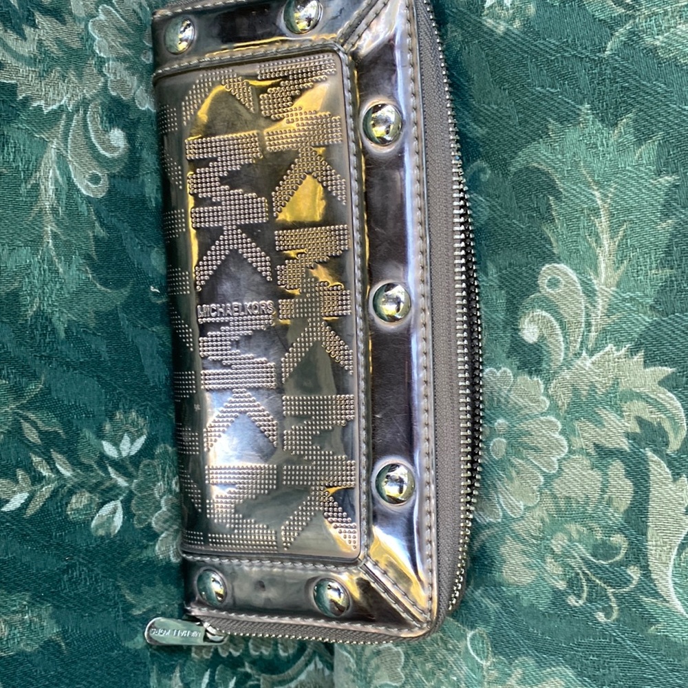 Hey, this is a genuine Michael Kors wallet used but in awesome shape